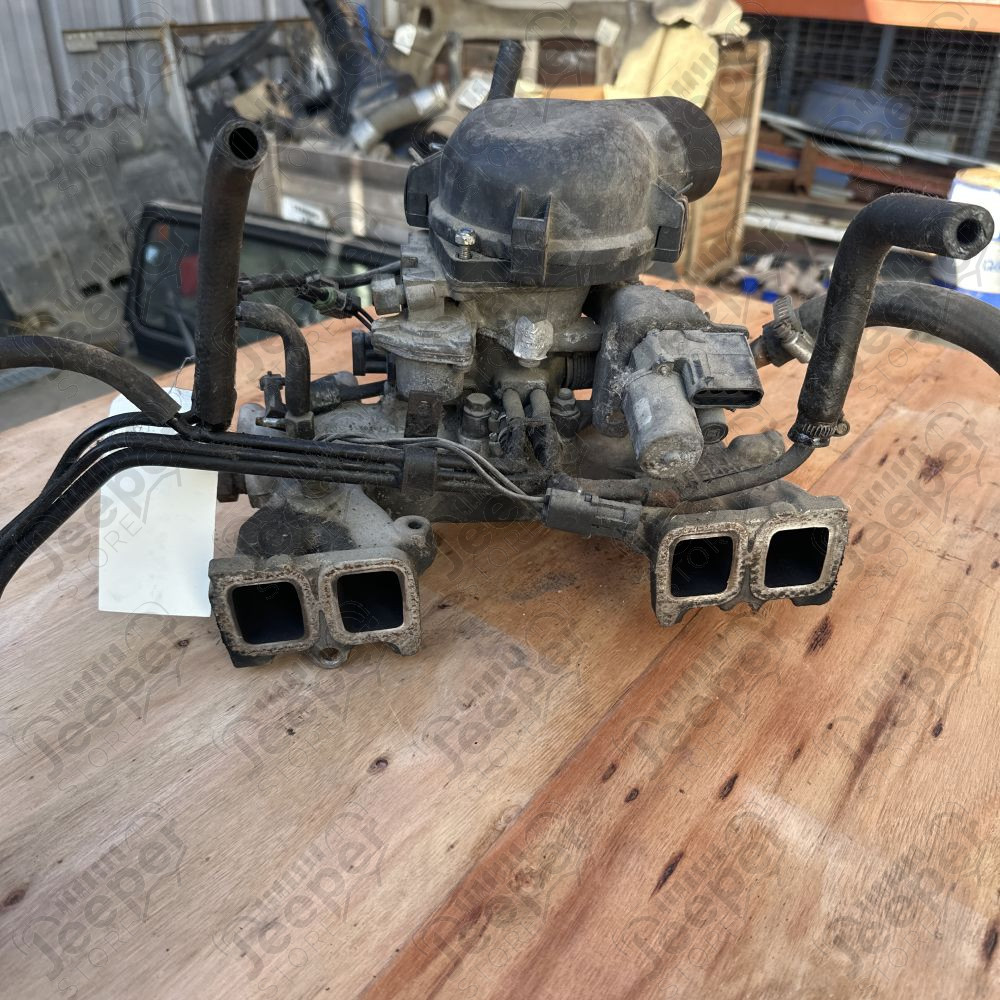 Occasion : Collecteur d’admission complète avec boîtier papillon d’injection 2.5L mono point pour YJ, XJ (1987-1991)