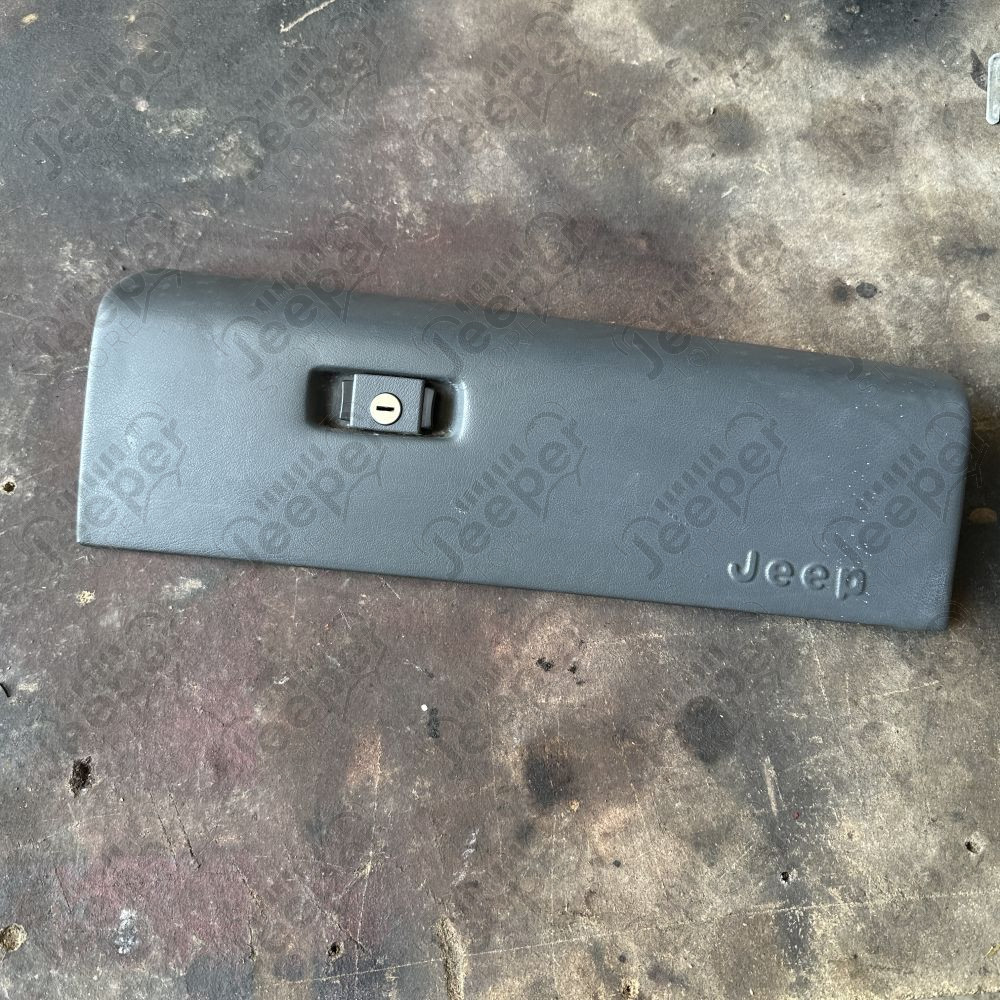 Occasion : Porte de boîte à gants passager couleur grise pour Jeep Cherokee XJ (1984-1996)