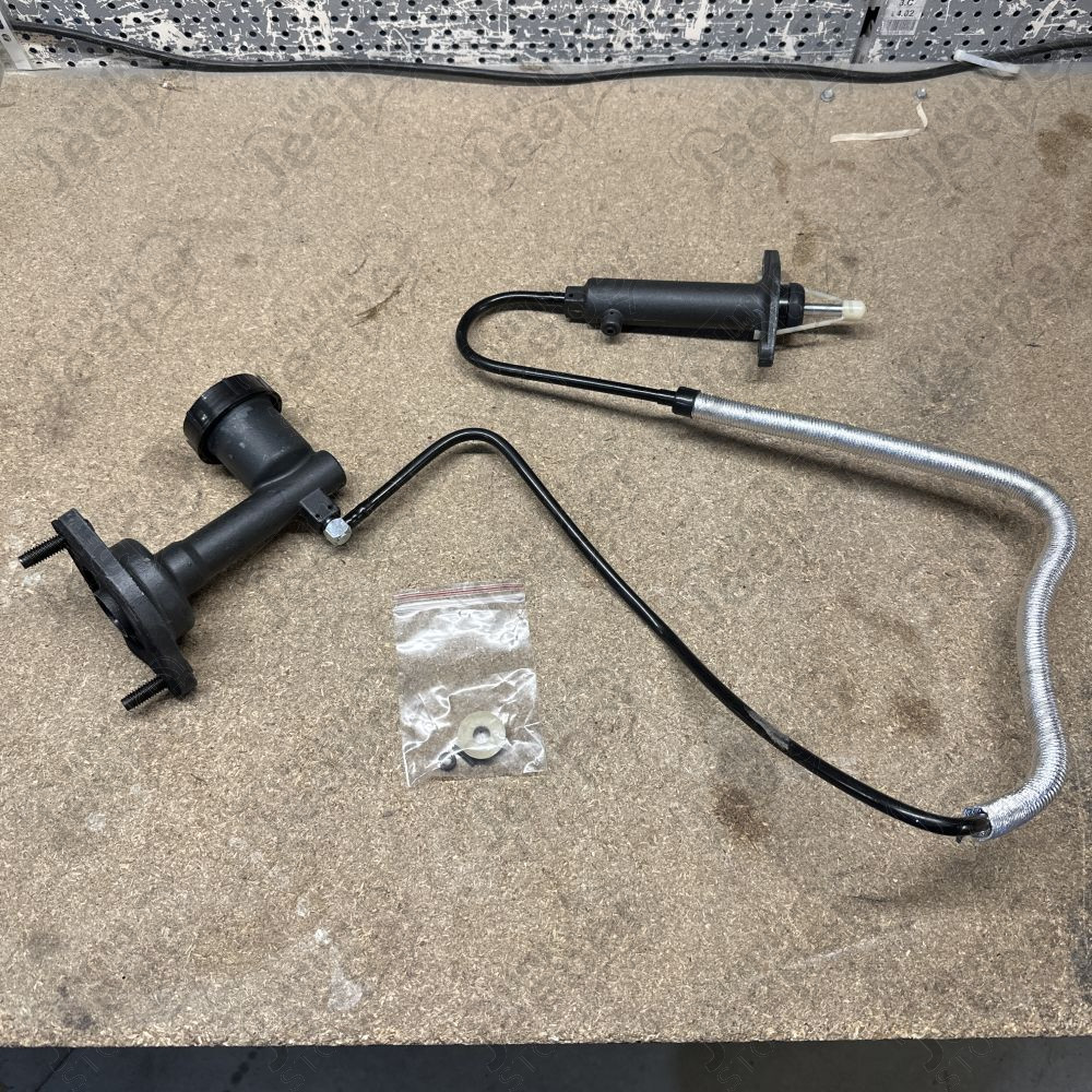 Occasion : Kit émetteur récepteur 2.5L et 4.0L (manque tige de poussé) pour Jeep Wrangler TJ (1996-2002)