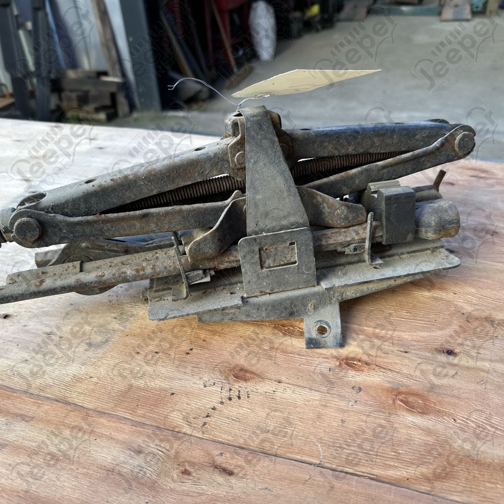 Occasion : Cric complet avec son support sur aile droite pour Jeep Wrangler YJ (1987-1995)