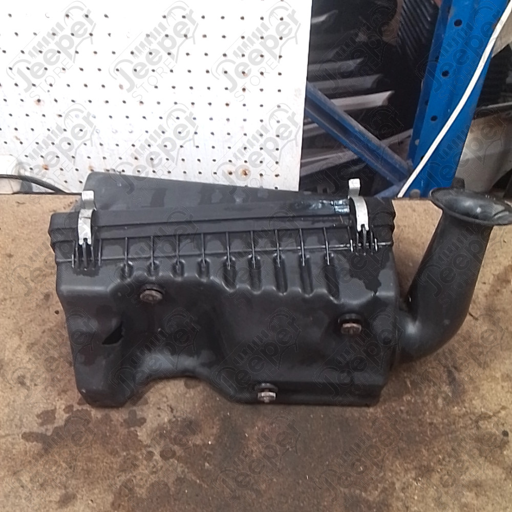 Occasion : Boîte à air pour 4.0L essence (dessous cassé) pour Jeep Cherokee XJ
