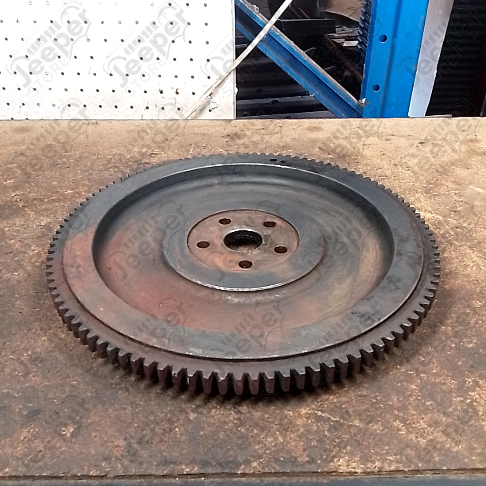 Occasion : Volant moteur / dents : 104 dents / diamètre : 33,5 cm / profondeur : 4 cm pour Jeep divers