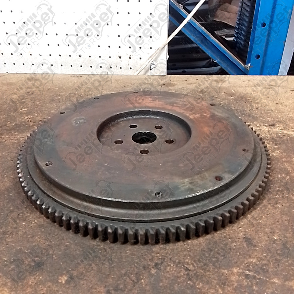 Occasion : Volant moteur / dents : 104 dents / diamètre : 33,5 cm / profondeur : 4 cm pour Jeep divers