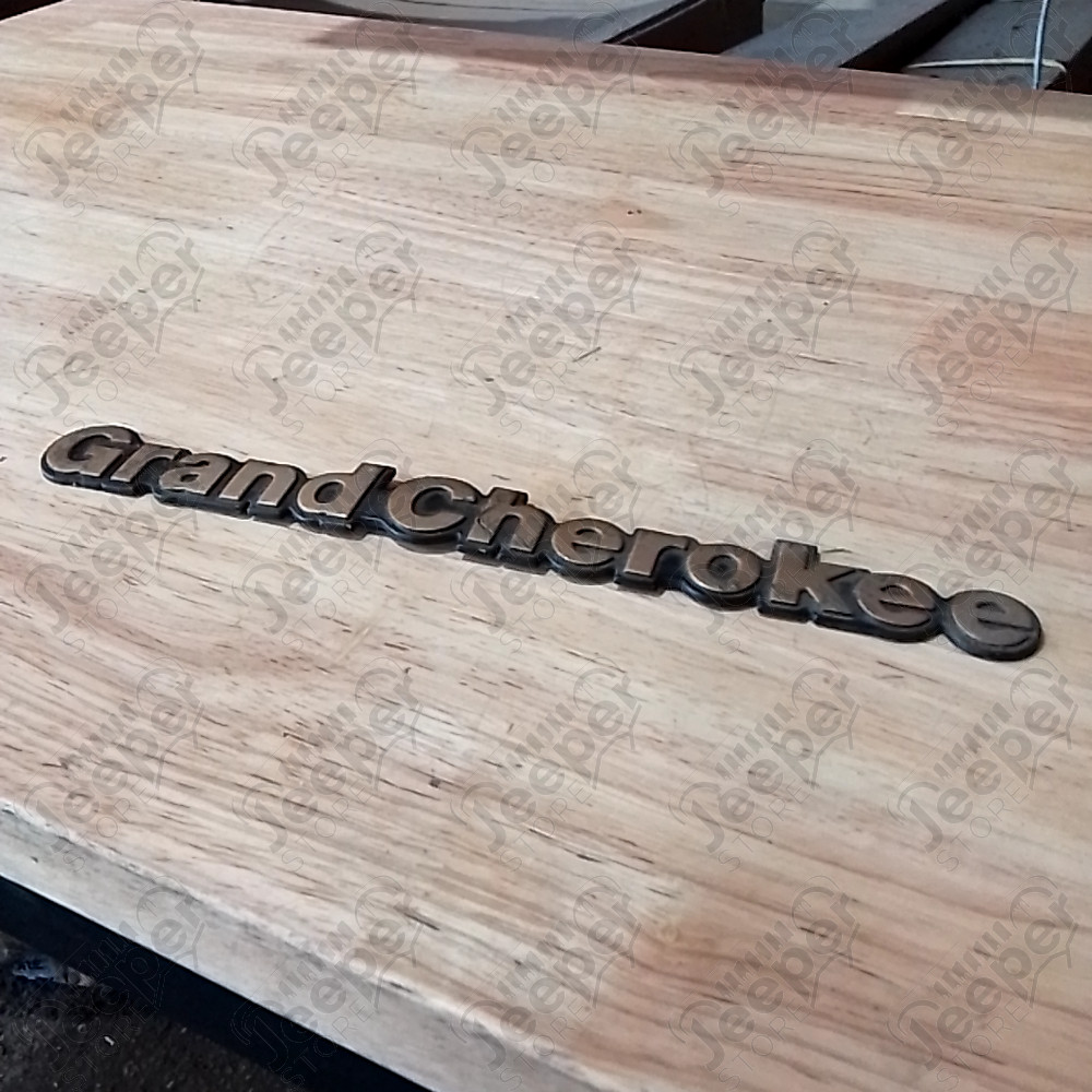 Occasion : Emblème logo "Grand Cherokee" pour Jeep ZJ, ZG, WJ, WG