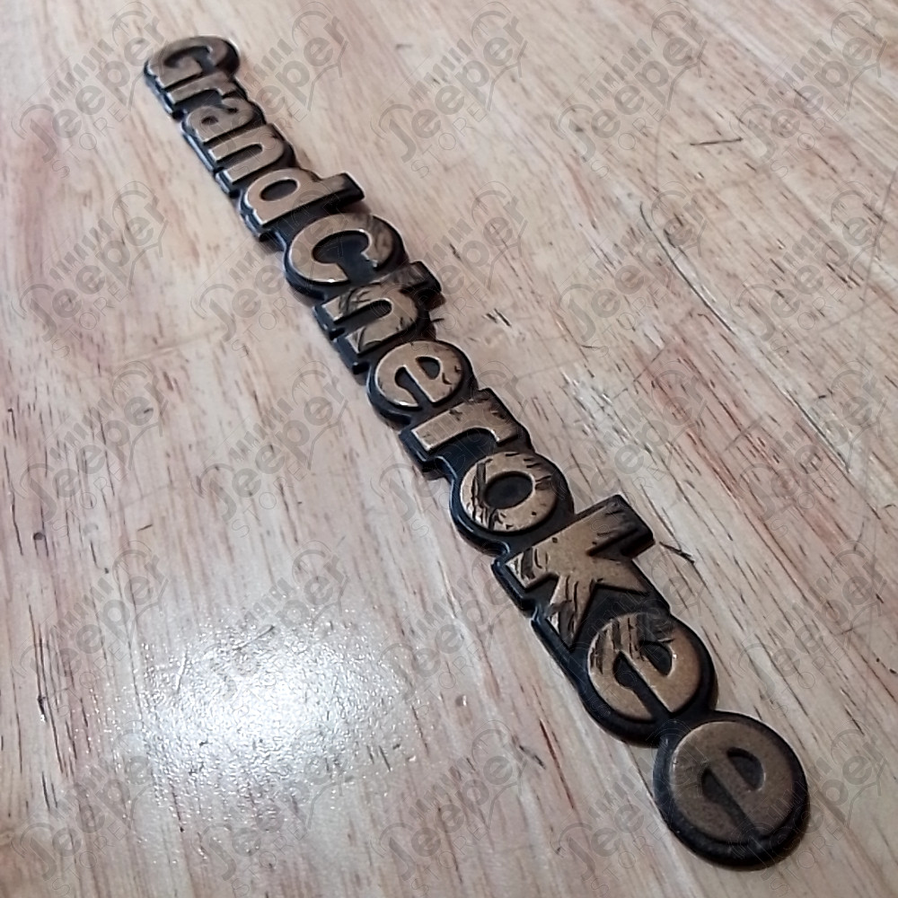 Occasion : Emblème logo "Grand Cherokee" pour Jeep ZJ, ZG, WJ, WG