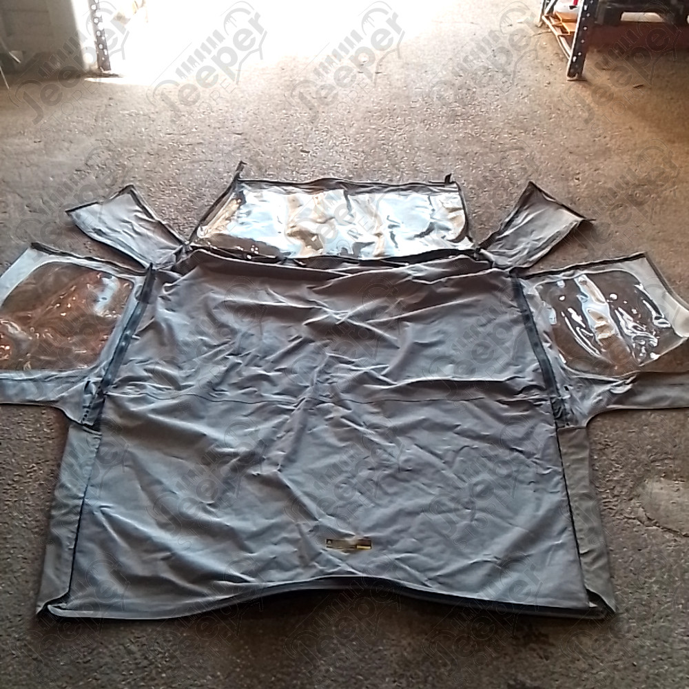 Occasion : Bâche Bestop grise avec fenêtres et lunette arrière plastique, incomplète sans aucune armature. pour Jeep CJ7, YJ
