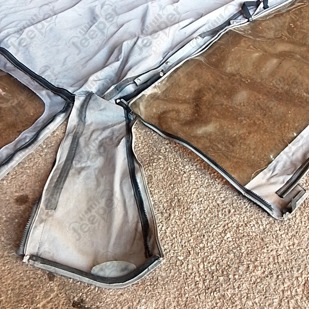 Occasion : Bâche Bestop grise avec fenêtres et lunette arrière plastique, incomplète sans aucune armature. pour Jeep CJ7, YJ
