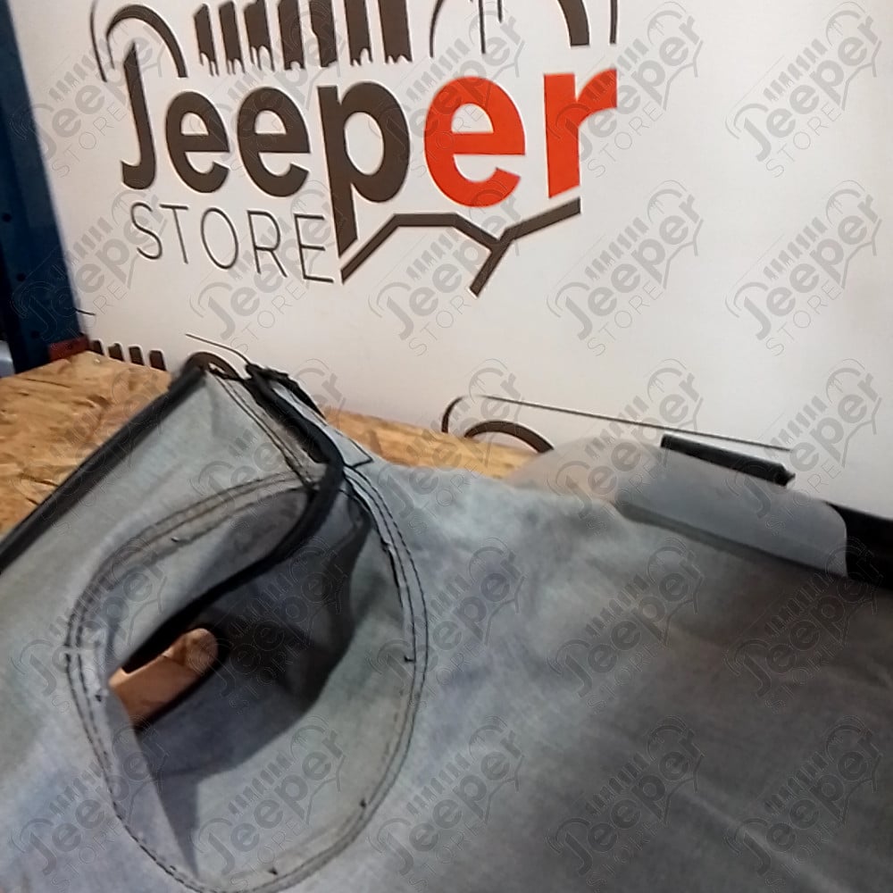 Occasion : Duster avec baguette coffre couvre plateau noir Bestop (déchirure) pour Jeep Wrangler YJ