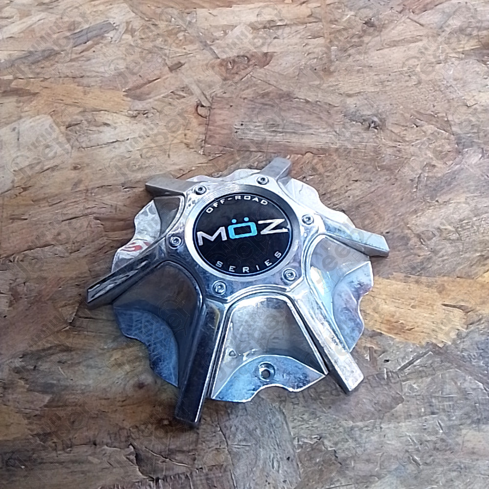 Occasion : Cache moyeu chromé en plastique MÖZ pour jante aluminium pour Jeep divers