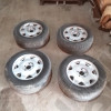 Occasion : Lot de 4 roues (jante d'origine) + 2 pneus VREDESTEIN et 2 pneus GENERAL en 235/60ZR16 pour Cadillac Seville STS 4.6L V8 - 32 soupapes - 4 portes - Boite automatique 4 rapports